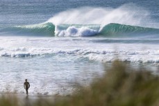 Keo Morrison heads out during a fun swell at St Kilda, Dunedin, New Zealand.Photo: Derek Morrison