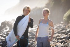 Keo Morrison and Nova Hammond chasing waves during a swell on the north coast of Dunedin, New Zealand.