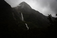 Water pours off the mountains during a tour exploring Doubtful Sound with Fiordland Expeditions Limited aboard the Tutoko II in Doubtful Sound, Fiordland, New Zealand. Photo: Derek Morrison
