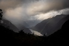 Water pours off the mountains during a tour exploring Doubtful Sound with Fiordland Expeditions Limited aboard the Tutoko II in Doubtful Sound, Fiordland, New Zealand. Photo: Derek Morrison