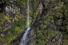 Water pours off the mountains during a tour exploring Doubtful Sound with Fiordland Expeditions Limited aboard the Tutoko II in Doubtful Sound, Fiordland, New Zealand. Photo: Derek Morrison