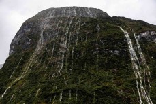 Water streams off a mountain during a tour exploring Doubtful Sound with Fiordland Expeditions Limited aboard the Tutoko II in Doubtful Sound, Fiordland, New Zealand. Photo: Derek Morrison