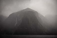 Water pours off the mountains during a tour exploring Doubtful Sound with Fiordland Expeditions Limited aboard the Tutoko II in Doubtful Sound, Fiordland, New Zealand. Photo: Derek Morrison