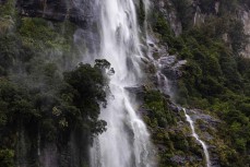 Water pours off the mountains during a tour exploring Doubtful Sound with Fiordland Expeditions Limited aboard the Tutoko II in Doubtful Sound, Fiordland, New Zealand. Photo: Derek Morrison