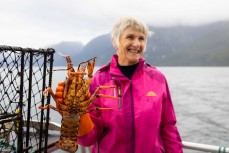 Dawn Dowling with a crayfish she hauled up during a tour exploring Doubtful Sound with Fiordland Expeditions Limited aboard the Tutoko II in Doubtful Sound, Fiordland, New Zealand. Photo: Derek Morrison