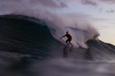 Brett Wood on a dusk wave in the Mentawai Islands, Sumatra, Indonesia.