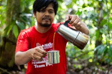 Guide and photographer Yudha Pohan in the jungle of the Gunung Leuser National Park at Bukit Lawang, Northern Sumatra, Indonesia.