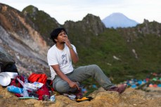 Yudha Pohan slices a mango and prepares coffee during a climb of Mt Sibayak (2212m) near Bergastagi, Northern Sumatra, Indonesia.