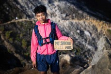 A young Indonesian climber smokes a cigarette near the summit of Mt Sibayak (2212m) near Bergastagi, Northern Sumatra, Indonesia.