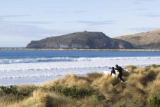 Family surf during a clean winter swell at Aramoana Dunedin, New Zealand.Photo: Derek Morrison