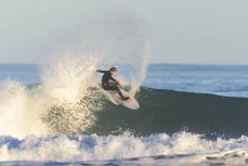 Keo Morrison makes the most of a wintry session at Blackhead, Dunedin, New Zealand.Photo: Derek Morrison
