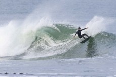 Kahu Kaan making the most of a winter swell at a remote beachbreak near Dunedin, New Zealand.Photo: Derek Morrison