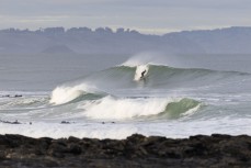 Kahu Kaan making the most of a winter swell at a remote beachbreak near Dunedin, New Zealand.Photo: Derek Morrison