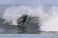 Dane Robertson throwing buckets during a winter swell at a remote beachbreak near Dunedin, New Zealand.Photo: Derek Morrison