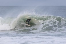 Luke Rogers makes the most of a winter swell at a remote beachbreak near Dunedin, New Zealand.Photo: Derek Morrison