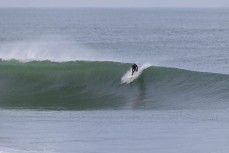 Luke Rogers makes the most of a winter swell at a remote beachbreak near Dunedin, New Zealand.Photo: Derek Morrison
