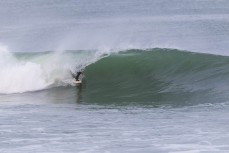 Luke Rogers makes the most of a winter swell at a remote beachbreak near Dunedin, New Zealand.Photo: Derek Morrison