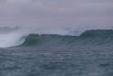 Clean swell pulsing through at a reefbreak in the Mentawai Islands, Sumatra, Indonesia.