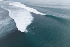 Clean swell pulsing through at a reefbreak in the Mentawai Islands, Sumatra, Indonesia.