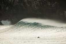 Sam Guthrie watches a perfect wave break in the Catlins south of Dunedin, New Zealand. 