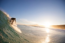 Limited Edition: A surfer drops into a wave on dusk at Blackhead Beach, Dunedin, New Zealand. 