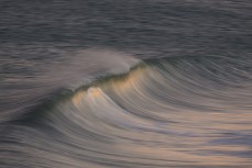 An empty wave breaks at Blackhead Beach, Dunedin, New Zealand. 