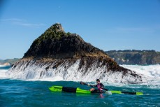 A paddler makes his way around White Island during a big swell at the 2014 White Island Race held by St Clair Surf Lifesaving Club at St Clair Beach, Dunedin, New Zealand on October 25, 2014. 