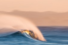An empty wave peels through during fun arvo waves at Blackhead Beach, Dunedin, New Zealand.