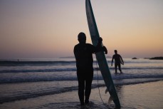 Early morning session for Mal and his son Simon at Sandy Bay, Tutukaka Coast, Northland, New Zealand.